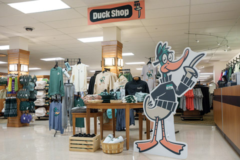 Delta College Bookstore sign says Duck gear and cardboard cutout of Duck mascot