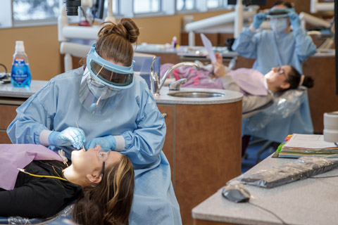 Delta College dental hygiene students real patients' teeth in the on-site dental clinic