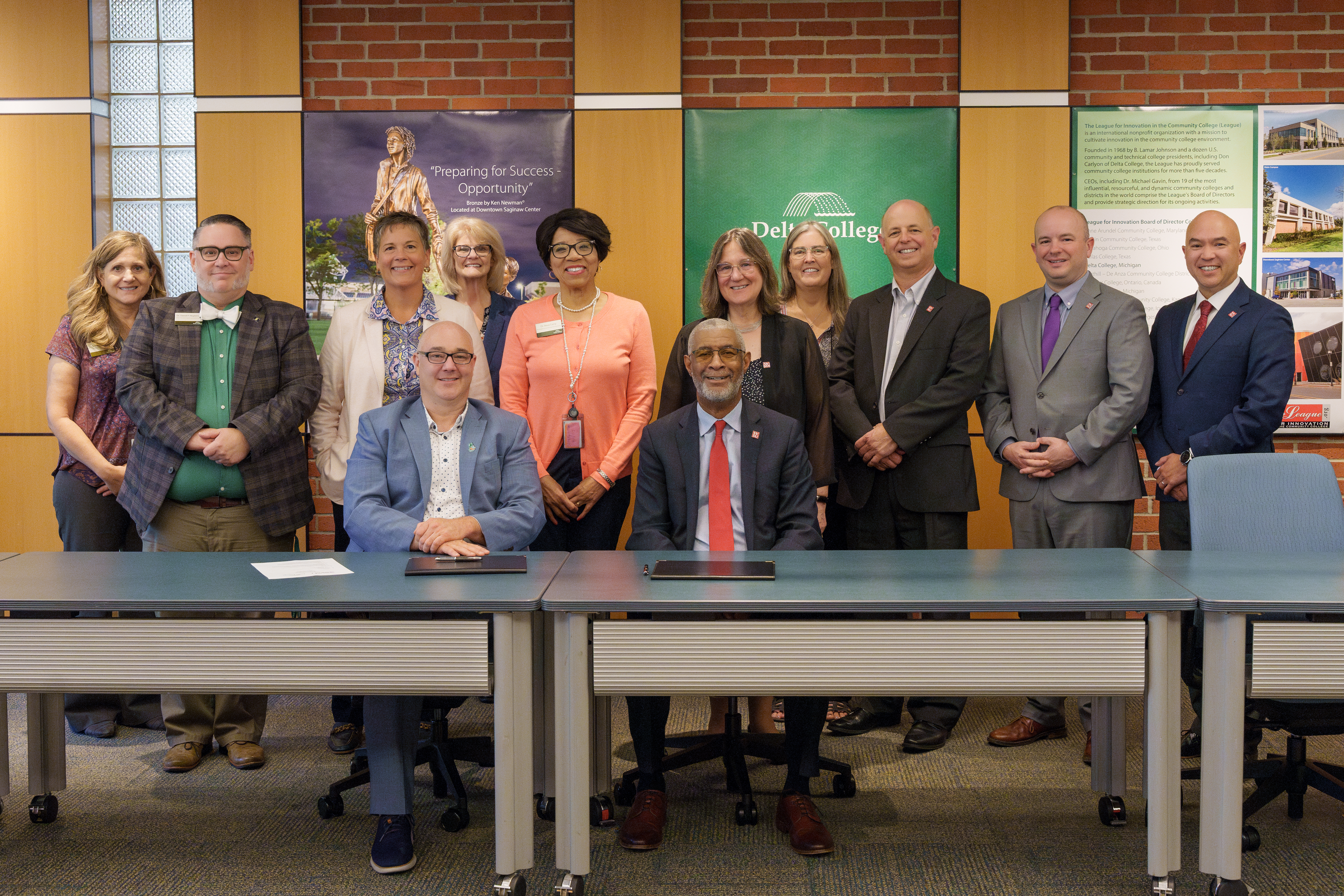 Group of 12 representatives from Delta College and SVSU pose for a photo