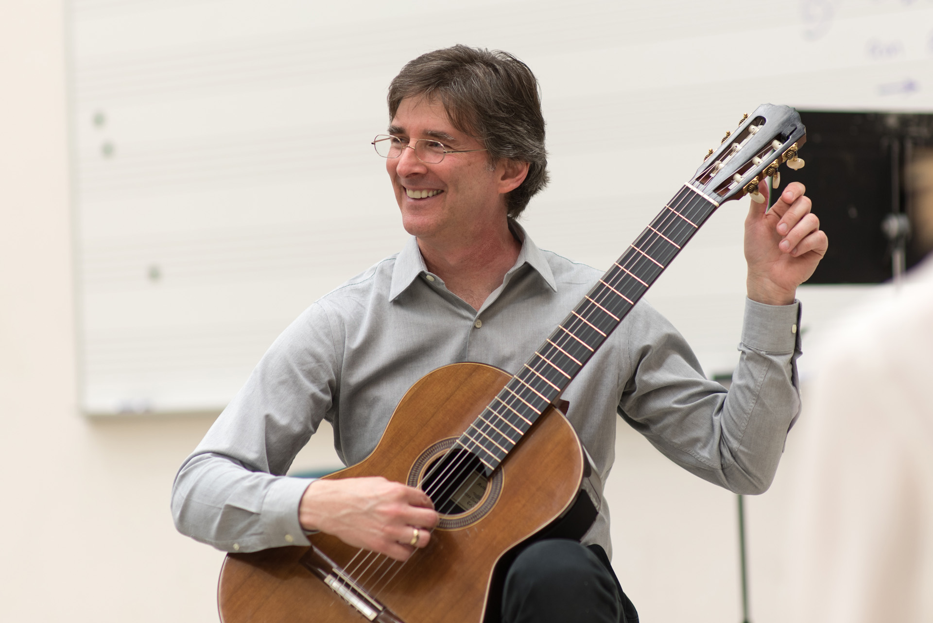 Brad DeRoche with his guitar