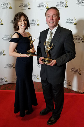 Przybylski and Wells holding their awards