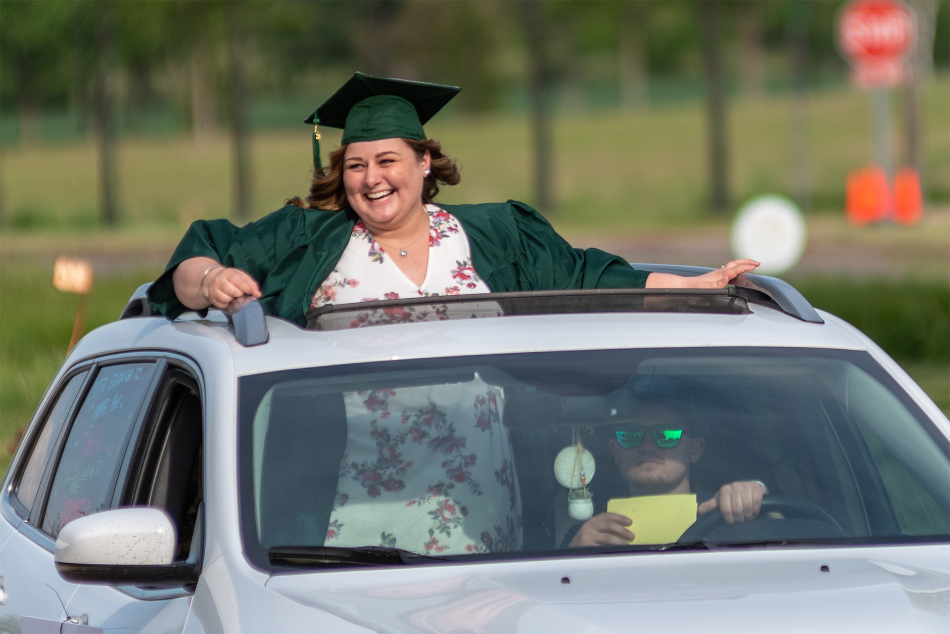 Student in car at Cruise-in Commencement