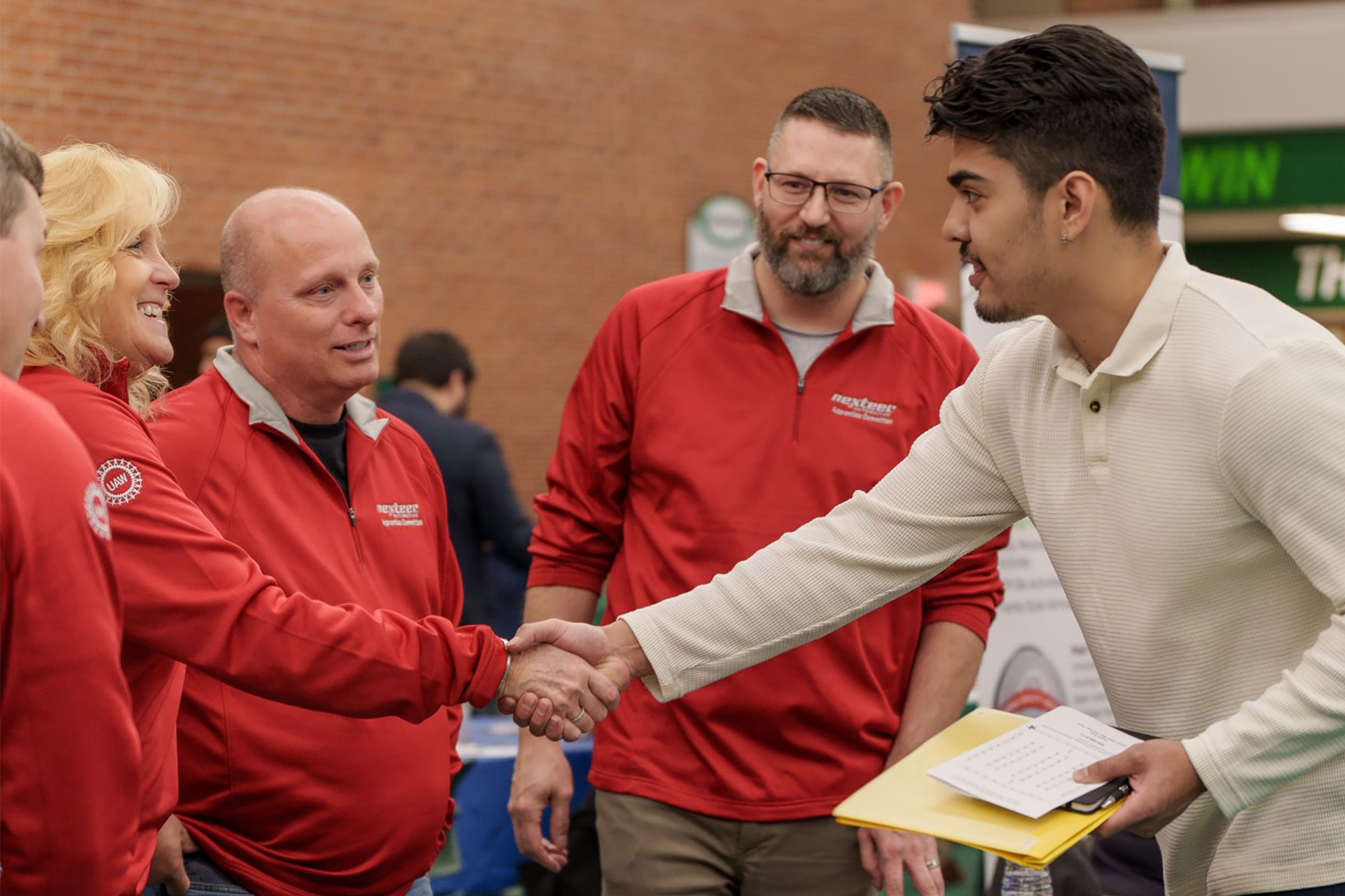 Job fair participant with employer