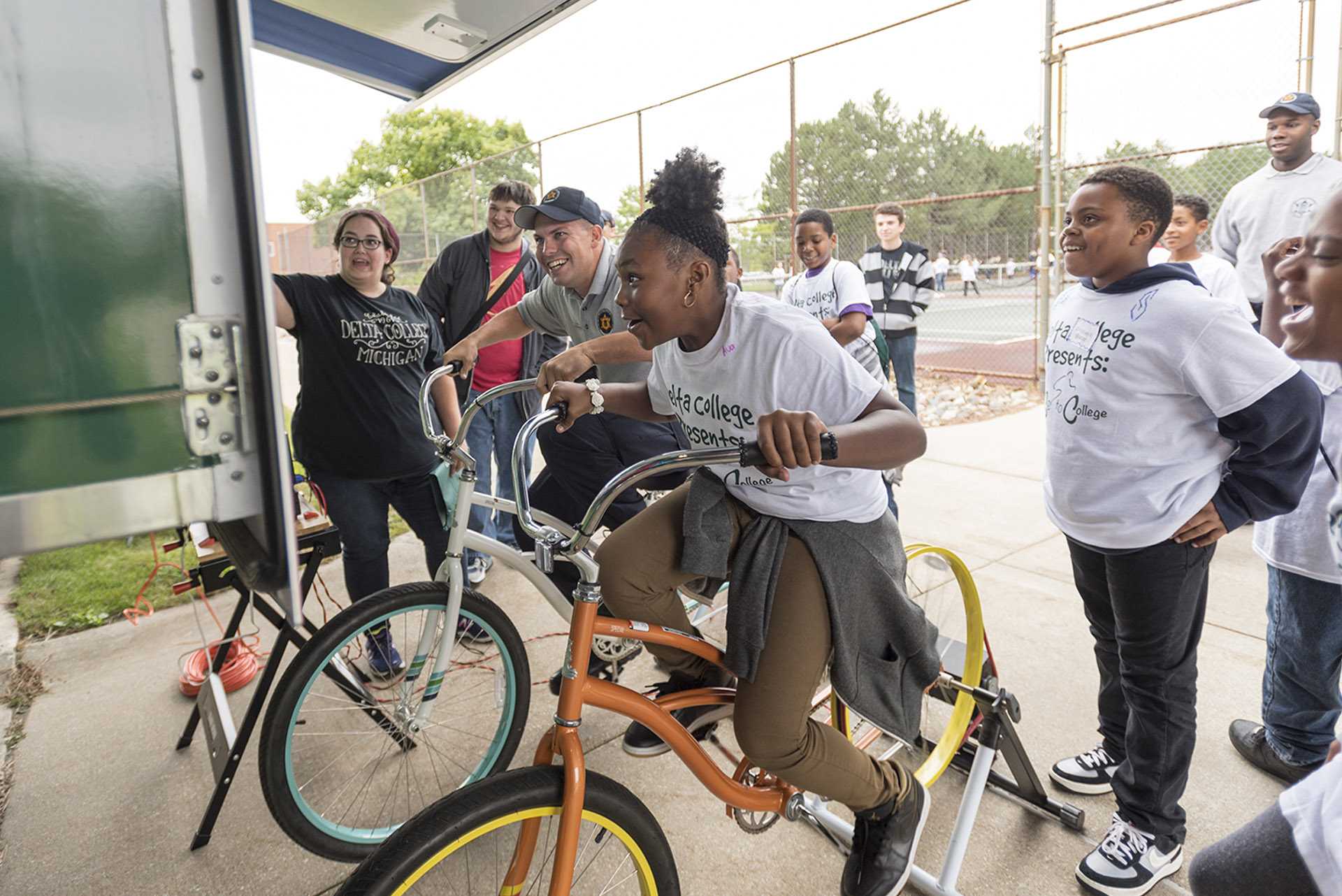 Kids riding a stationary bike with the STEM Explorer