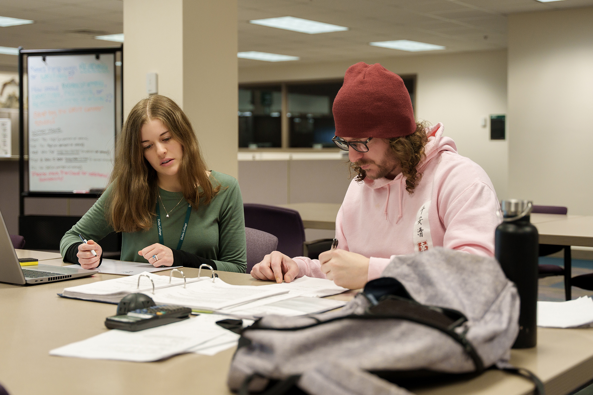 Student working with Tutor in the Library